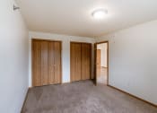 Thumbnail 10 of 17 - Grand Forks, ND Creekside Apartments. A bedroom with two closets.