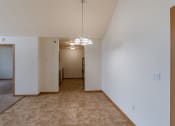 Thumbnail 8 of 17 - Grand Forks, ND Creekside Apartments. A dining room of an apartment with white walls and carpeting