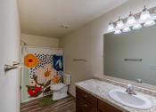 Thumbnail 18 of 19 - Grand Forks, ND Grandview Apartments. A bathroom with a sink, toilet, and bathtub