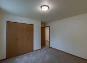 Thumbnail 16 of 19 - Grand Forks, ND Grandview Apartments. A bedroom with a closet.
