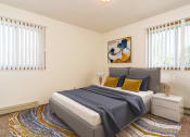 Thumbnail 3 of 19 - Grand Forks, ND Grandview I Apartments. a bedroom with a bed and two windows