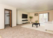 Thumbnail 2 of 19 - Grand Forks, ND Grandview I Apartments. a living room with a white couch and a black coffee table