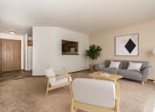 Thumbnail 7 of 28 - A living room with a couch chairs and a coffee table  at Harrison and Richfield, Grand Forks, North Dakota
