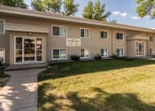 Thumbnail 6 of 7 - Goldmark's Louise building with a lawn and walkway in front of it