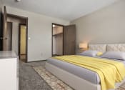 Thumbnail 5 of 25 - Grand Forks Primrose Apartments.a bedroom with a bed and a mirror