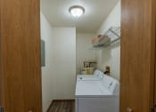 Thumbnail 25 of 28 - Grand Forks, ND Richfield Apartments. A laundry room with a washer and dryer in it