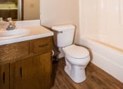 Thumbnail 9 of 10 - Grand Forks Ridgemont Apartments. A bathroom with a sink, toilet, and bathtub