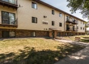 Thumbnail 10 of 10 - Grand Forks Ridgemont Apartments. The exterior of a three level apartment building.