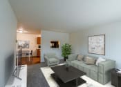 Thumbnail 4 of 22 - An open living room with a couch and a coffee table. Grand Forks, ND Southview Apartments.