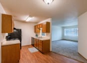 Thumbnail 19 of 22 - Grand Forks, ND Southview Apartments. A kitchen with white appliances.