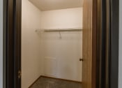 Thumbnail 17 of 22 - Grand Forks, ND Southview Apartments. A walk in closet with shelves.