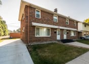 Thumbnail 1 of 6 - Grand Forks, ND Valley Home Duplex. a view of the front of the house