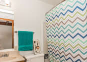 Thumbnail 6 of 8 - Grand Forks, ND Washington Apartments. A decorated bathroom