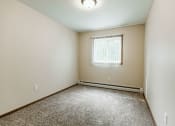 Thumbnail 13 of 17 - Grand Forks, ND Grandview II Apartments. A bedroom with a window.