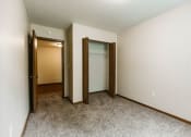 Thumbnail 14 of 17 - Grand Forks, ND Grandview II Apartments. A bedroom with a closet.