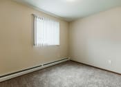 Thumbnail 15 of 17 - Grand Forks, ND Grandview II Apartments. A bedroom with a window.