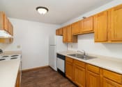Thumbnail 15 of 23 - a kitchen with white appliances. Hutchinson, MN Deer Park Apartments
