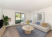 Thumbnail 1 of 23 - a living room with a couch and a coffee table. Hutchinson, MN Deer Park Apartments