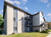 Thumbnail 21 of 23 - the exterior of a three level apartment building. Hutchinson, MN Deer Park Apartments