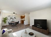 Thumbnail 1 of 11 - a living room with a couch and a table and a television. Hutchinson, MN Echo Manor Apartments