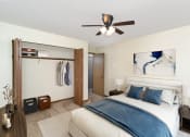 Thumbnail 3 of 18 - a bedroom with a large bed and a ceiling fan. Hutchinson, MN Twin Oaks