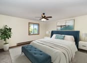 Thumbnail 6 of 18 - a bedroom with a large bed and a ceiling fan. Hutchinson, MN Twin Oaks