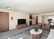 Thumbnail 5 of 18 - a living room with a couch and chairs and a television. Hutchinson, MN Twin Oaks