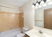 Thumbnail 12 of 18 - a bathroom with a tub and a sink and a toilet. Hutchinson, MN Twin Oaks Townhomes