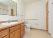 Thumbnail 8 of 21 - a bathroom with a sink and a toilet and a shower. Fargo, ND Sunrise North
