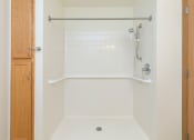 Thumbnail 10 of 21 - a bathroom with a stand in shower. Fargo, ND Sunrise North