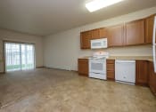 Thumbnail 3 of 23 - a kitchen with white appliances and wooden cabinets. Fargo, ND North Sky Apartments