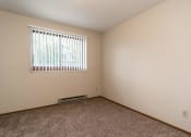Thumbnail 8 of 20 - Grand Forks, ND Library Lane Apartmentsa bedroom with a window and carpet