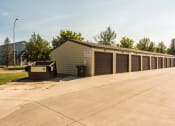 Thumbnail 20 of 20 - Grand Forks, ND Library Lane Apartments a row of garages