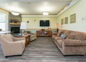 Thumbnail 13 of 21 - a community area with a tv and couches. Fargo, ND Sunrise North