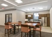 Thumbnail 24 of 32 - Montreal Courts Apartments in Little Canada, MN | Community Room Kitchen & Dining Area