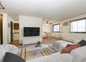 Thumbnail 4 of 32 - Montreal Courts Apartments in Little Canada, MN | Two Bedroom | Living Room & Dining Area
