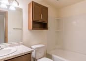 Thumbnail 14 of 16 - a bathroom with a sink toilet and a bath tub. Moorhead, MN South Park Apartments