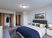 Thumbnail 5 of 16 - a bedroom with a bed and a closet. Moorhead, MN South Park Apartments