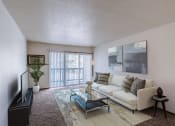 Thumbnail 1 of 16 - a living room with a couch and a coffee table. Moorhead, MN South Park Apartments