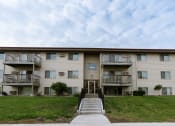 Thumbnail 15 of 16 - an apartment building with stairs and a green lawn. Moorhead, MN South Park Apartments