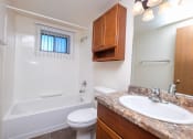Thumbnail 8 of 16 - a bathroom with a sink toilet and a bath tub. Fargo, ND North Manor Apartments