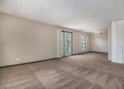 Thumbnail 12 of 21 - Omaha, NE Beacon Hill Apartments A living room with a ceiling fan