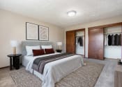 Thumbnail 6 of 23 - Omaha, NE Maple Ridge Apartments. A bedroom with a bed and a closet