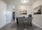 Thumbnail 3 of 23 - Omaha, NE Maple Ridge Apartments. A dining room with a table and chairs