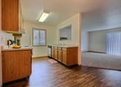 Thumbnail 28 of 31 - a kitchen with white appliances and wooden cabinets. Fargo, ND Oxford Apartments.