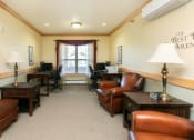 Thumbnail 17 of 21 - a library with chairs and a large window. Fargo, ND Sunrise North