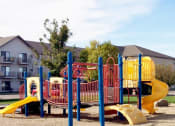 Thumbnail 23 of 23 - Hutchinson, MN Deer Park Apartments | Exterior with a park