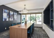 Thumbnail 18 of 30 - The Edge of Uptown Apartments | Conference Room with Large Table and 6 Chairs