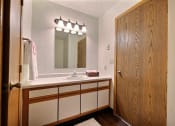 Thumbnail 11 of 25 - Bathroom with sink and mirror at Park Place Apartments in Fargo, ND
