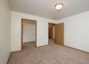 Thumbnail 10 of 15 - A bedroom with a walk in closet. Pinehurst Apartments | 2 Bedroom